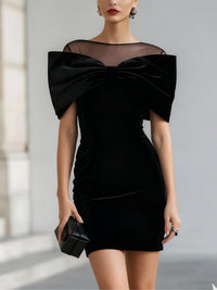 Elegant black velvet mini dress with bow