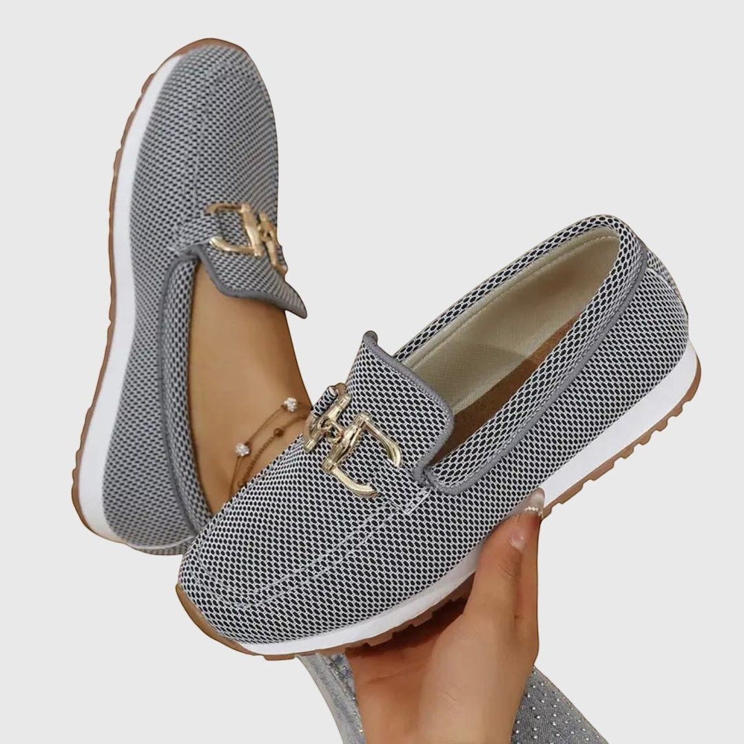 Nora & Elise Susie grey mesh orthopaedic moccasin trainers with gold horseshoe detail and non-slip sole.
