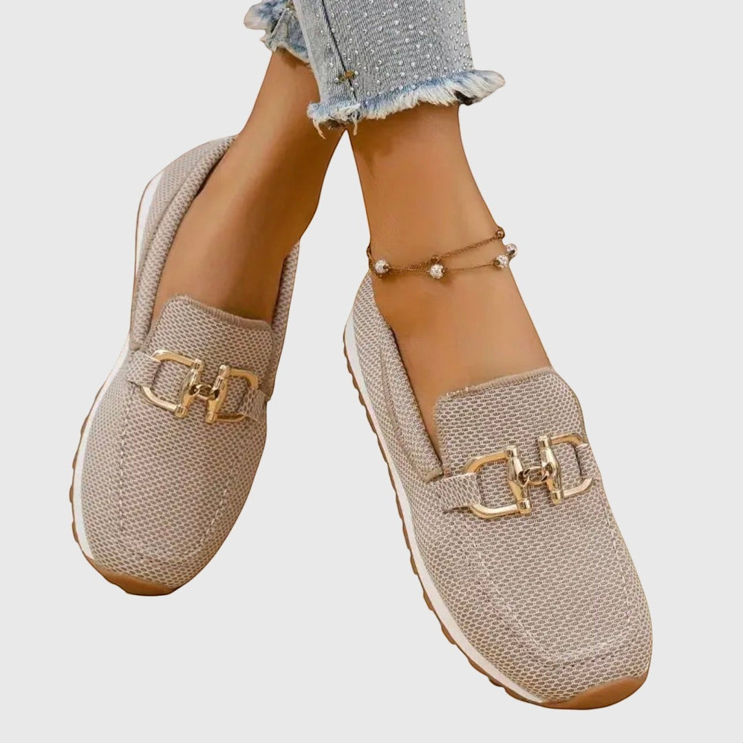 Nora & Elise Susie beige mesh orthopaedic moccasin trainers with gold buckle detail and non-slip sole.