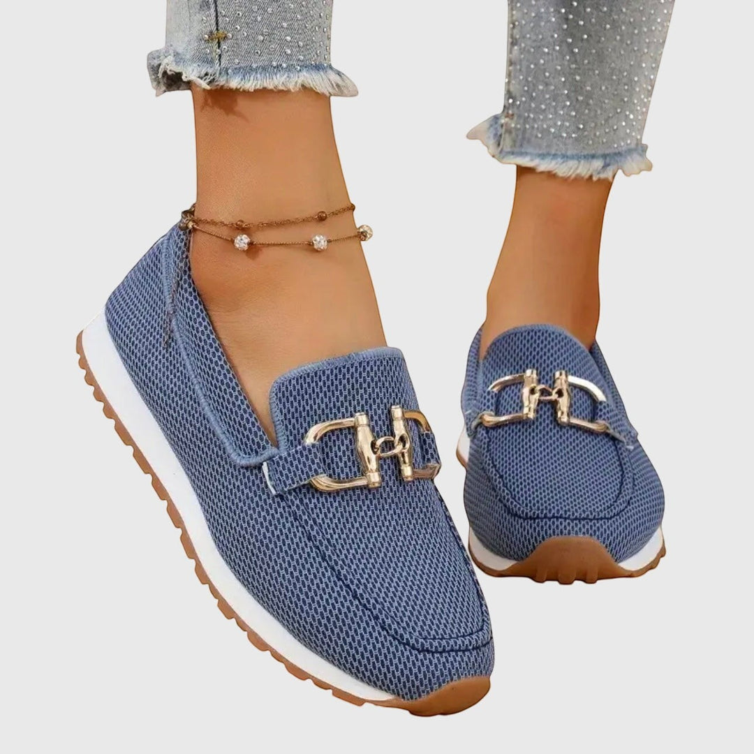 Nora & Elise Susie blue mesh orthopaedic moccasin trainers with gold buckle detail and white sole.