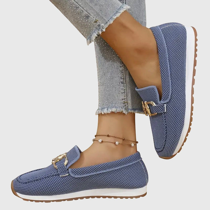 Nora & Elise Susie blue mesh orthopaedic moccasin trainers with gold buckle detail and white sole.