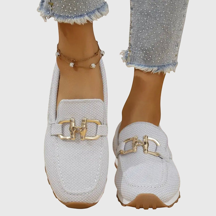 Nora & Elise Susie light grey mesh orthopaedic moccasin trainers with gold horseshoe detail and non-slip sole.